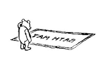 Winnie-the-Pooh looking at a bath mat